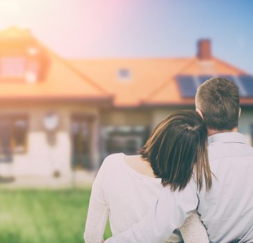 Young couple looking at dream house.