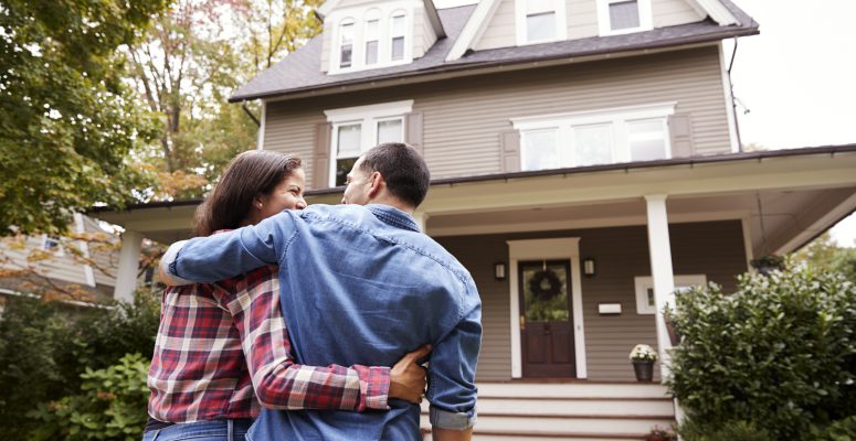 Rear View Of Loving Couple Walking Towards House